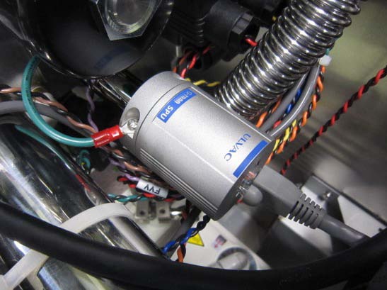 ULVAC HELIOT 900 turbomolecular pump assembly — inside instrument cabinet showing TMP and foreline valve